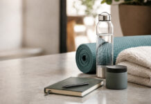 How Wellness Consumers Are Reshaping Cannabis Wellness items arranged beside an unbranded product container, representing consumers who use cannabis as part of functional lifestyle routines.